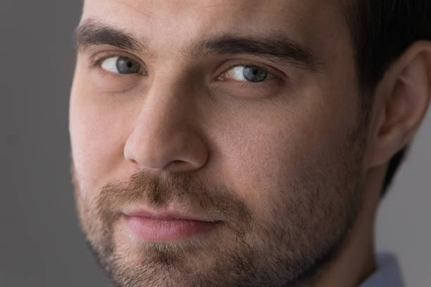 istock Close up handsome young man with bristle looking at camera. 1425167377