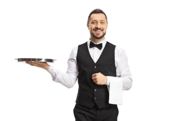 istock Waiter carrying a silver tray and smiling 1425168523