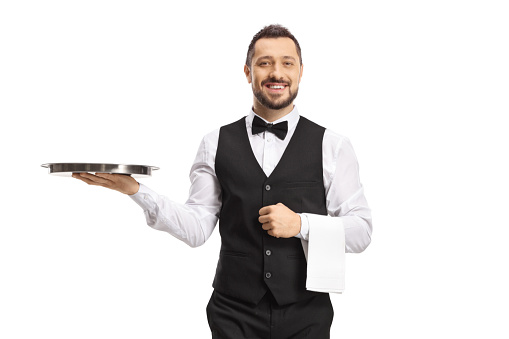Waiter carrying a silver tray and smiling isolated on white background