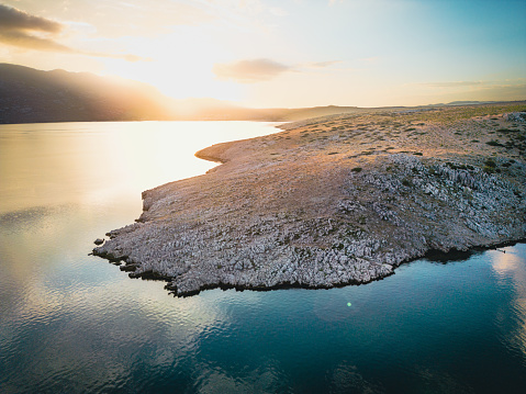 Aerial shot of rocky beaches near Zadar, Croatia at sunrise in the morning.