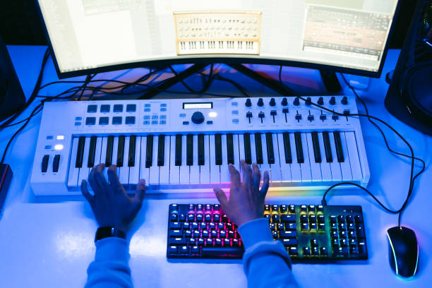 istock Close up sound producer hands working at studio 1425171604