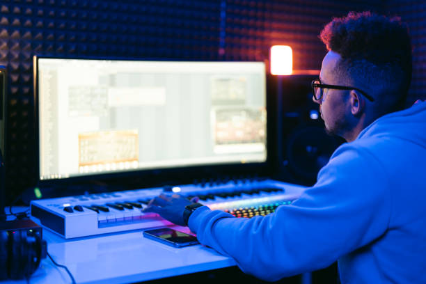 istock Young sound producer working at studio 1425171611
