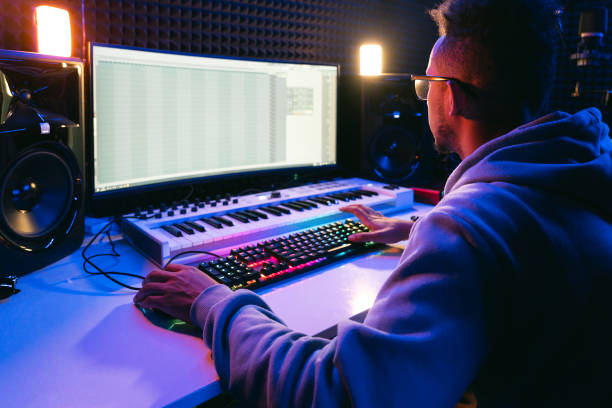 istock Young sound producer working at studio 1425171615