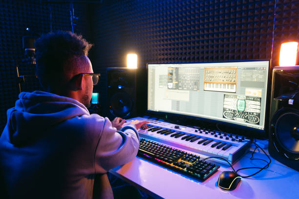 istock Young sound producer working at studio 1425171624