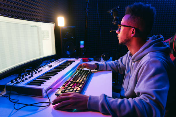 istock Young sound producer working at studio 1425171633