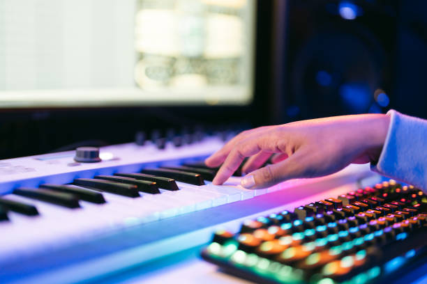 istock Close up sound producer hands working at studio 1425171643