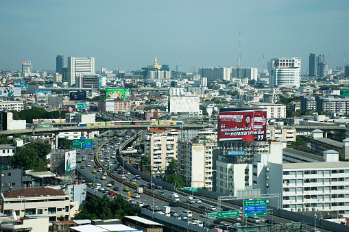 View landscape cityscape of bangkok city and high building tower condominium and traffic road busy jam on in Bangkok, Thailand