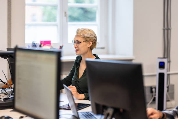 istock Woman executive working on computer in a coworking office 1425175226