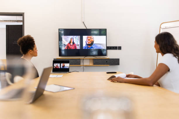 istock Two colleagues discussing with team through video call at startup 1425175458