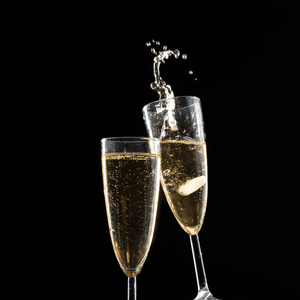 istock Glasses of champagne with splash 1425176922