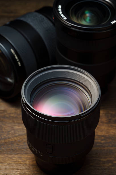 istock Close up of camera lens on wooden table 1425177664