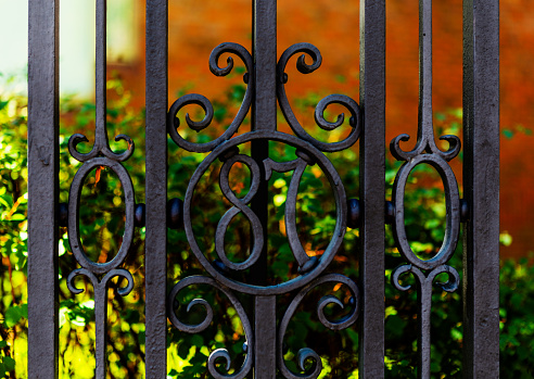 Cambridge, Massachusetts, USA - September 15, 2022: Close-up of the wrought iron 87 figure on gate on the north side of Harvard Yard. The Class of 1887 Gate was erected in 1906 from funds raised by the class.