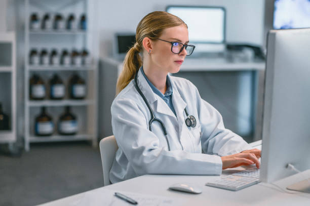istock Science, research and medicine with a woman scientist doing data analysis on a computer in her lab. Medical, innovation and healthcare with a female doctor or technician working in her laboratory 1425181392