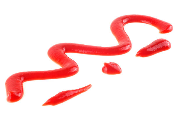 istock Red ketchup splash isolated on a white background. Zigzag of tomato ketchup. 1425182849