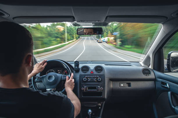 istock Hands on the wheel when driving at high speed from inside the car. 1425184174