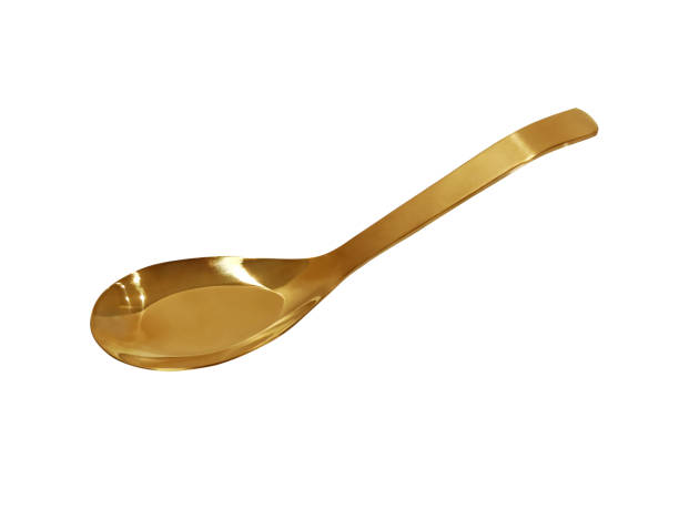 istock Stylish clean gold spoon on white background. 1425188842