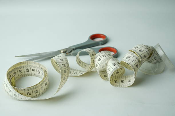 istock tape measure and fabric scissors 1425189701
