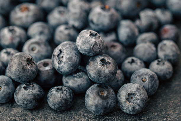 istock Wet ripe blueberries close up, macro shot. 1425190470