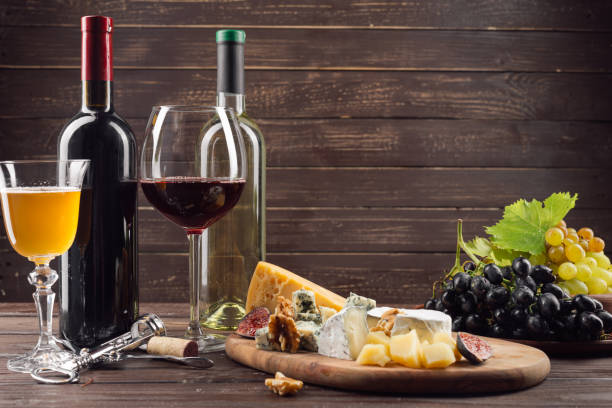 istock Wine bottle and grape on wooden table 1425191660