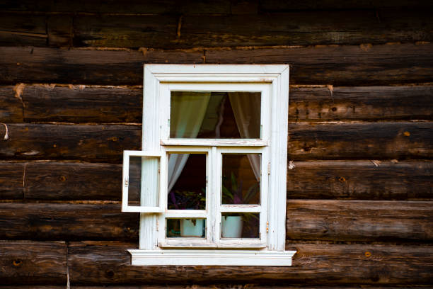 istock the window of an old log house 1425192587