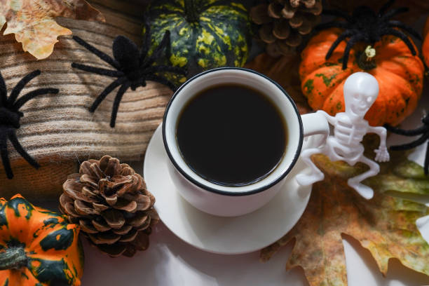 istock Halloween decor with a cup of hot coffee on the window sill 1425199507