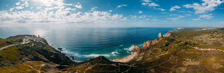 Panoramic 180 degree view of Cabo da Roca and Ursa Beach in Portugal with hiking trails visible. Cabo da Roca is continental Europe's westernmost point