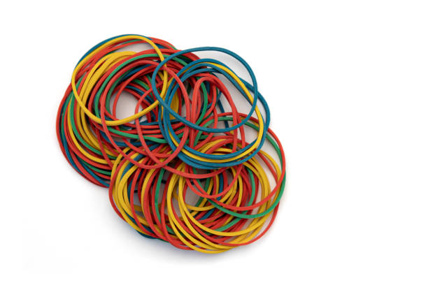 istock pile of colored rubber bands isolated on white, stationery 1425200742