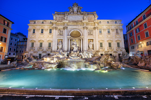 Rome, Italy overlooking Trevi Fountain during twilight.