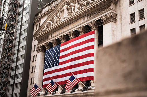 The front of the stock exchange is usually covered by some newly listed company but on this day it was covered by silky looking American flags making it look even more like the symbol of the USA.