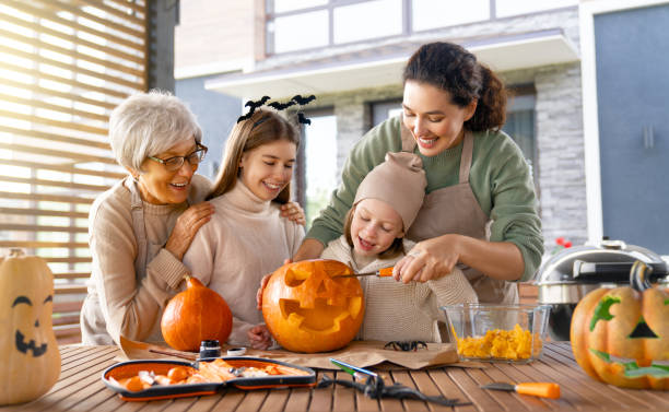 istock family preparing for Halloween 1425205531
