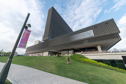 Hong Kong - April 9, 2022 : General view of the M+ Museum at West Kowloon Cultural District, Hong Kong. M+ is the new museum of visual culture in Hong Kong, as part of West Kowloon Cultural District, focusing on 20th and 21st century art, design and architecture and moving image.