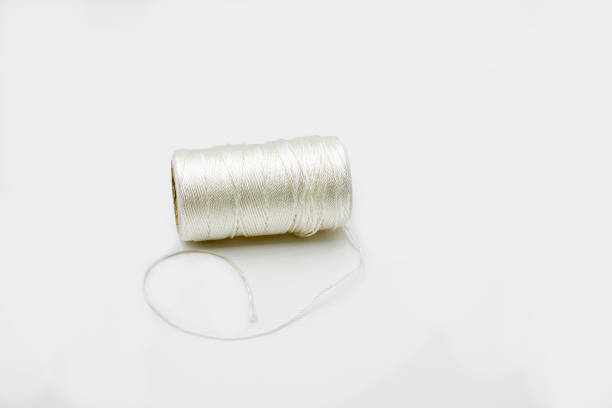 White thread for baking closeup on white stock photo