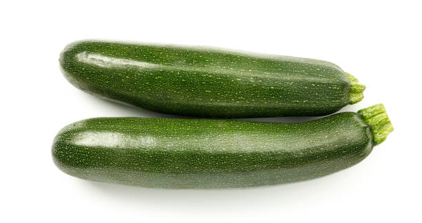 istock Green zucchini on a white background, ripe vegetables. 1425206822