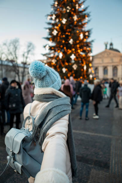 istock follow me concept woman pulling man to christmas tree 1425206926