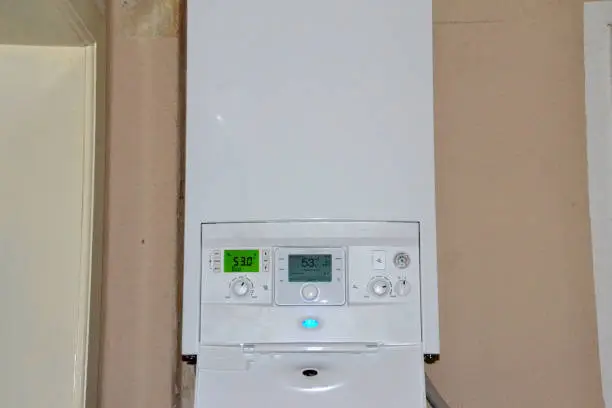 Photo of Modern condensing boiler of a gas heating system