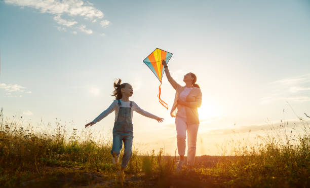 Happy family at sunset
