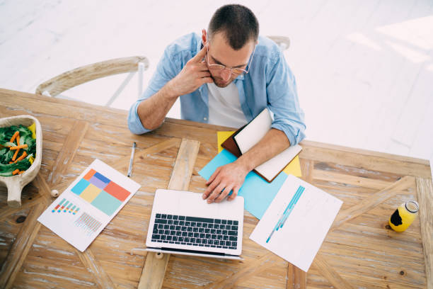istock Thoughtful man working on project on laptop 1425212303