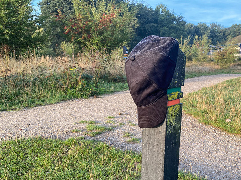 Loss cap in the heath hanging on pole