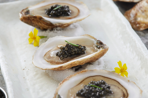 Raw Oysters on Ice with Caviar and Lemon Wedges