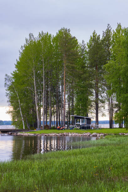 istock Modern little house along lake 1425217200