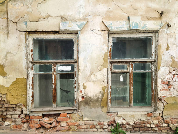 istock Windows in an old crumbling house 1425219653