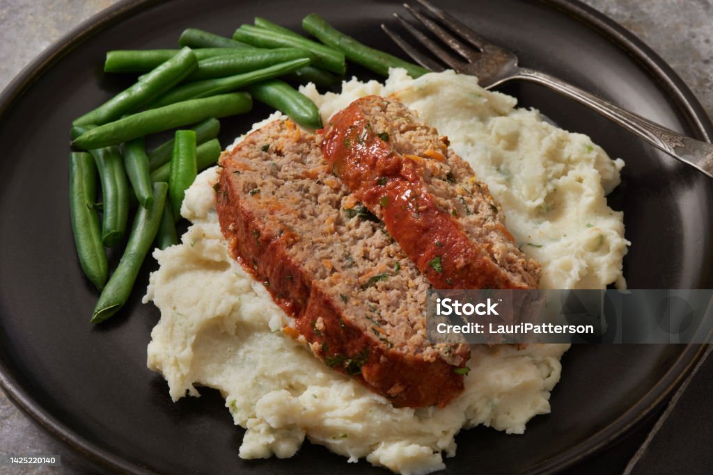 Moist Turkey and Spinach Meatloaf Moist Turkey and Spinach Meatloaf with Mashed Potato's and Steamed Green Beans Meat Loaf - Food Stock Photo