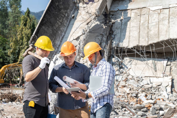istock Demolition control supervisor and contractor discussing on demolish building. 1425224952