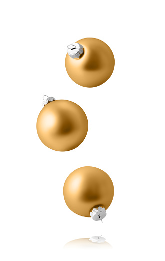 Christmas ornaments isolated on white background. Set of three falling gold christmas balls.