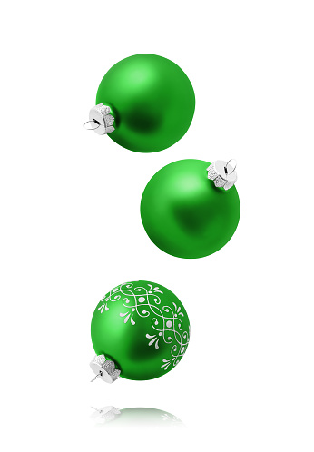 Christmas balls isolated on white background. Set of three falling green christmas ornaments.