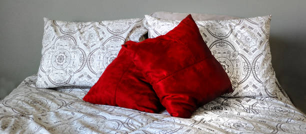istock Bed in Bedroom Red Pillows 1425227855