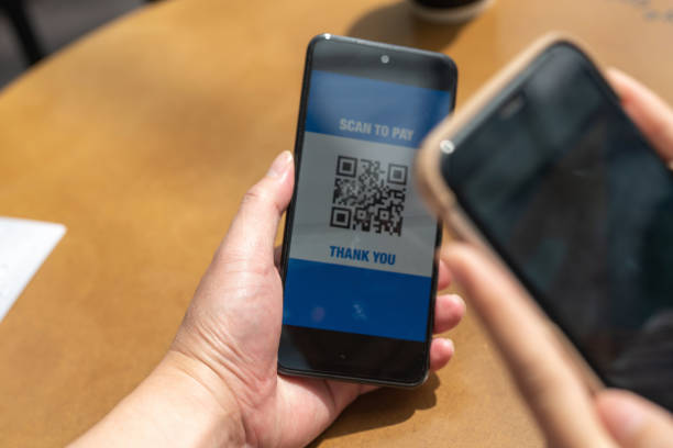 istock Close up photo of making a QR code payment by using smartphone to scan 1425230599