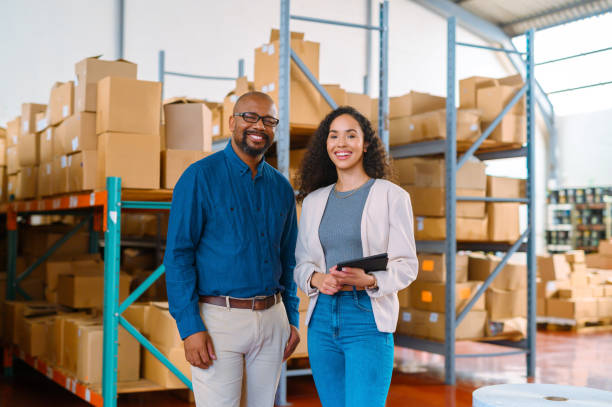 istock Management, collaboration and happy warehouse partner discussing logistics or a shipping schedule on a digital tablet. Portrait of a smiling team feeling proud of their career and efficient service 1425230621