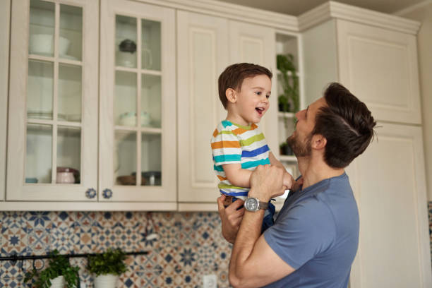 istock Young man spending quality time with his adorable son at home 1425230720