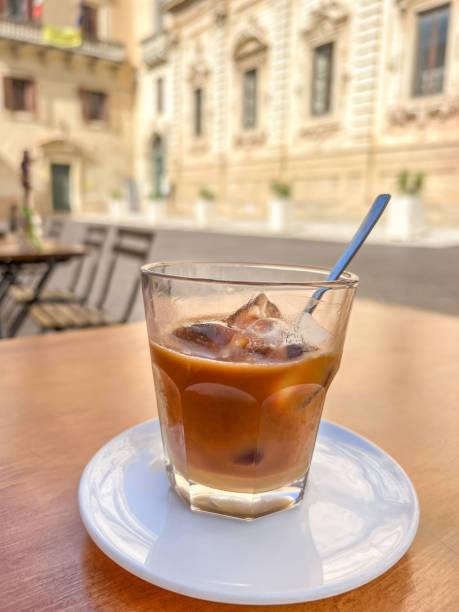 glass of cold iced coffee in Italy ice coffee, glass of cold iced coffee known as “leccese” in Lecce, salento region of Italy. traditional cold drink or beverage of Lecce in Italy. selective focus on glass with noise effects. lecce stock pictures, royalty-free photos & images